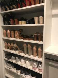 Shoes organized in clutter-free closet