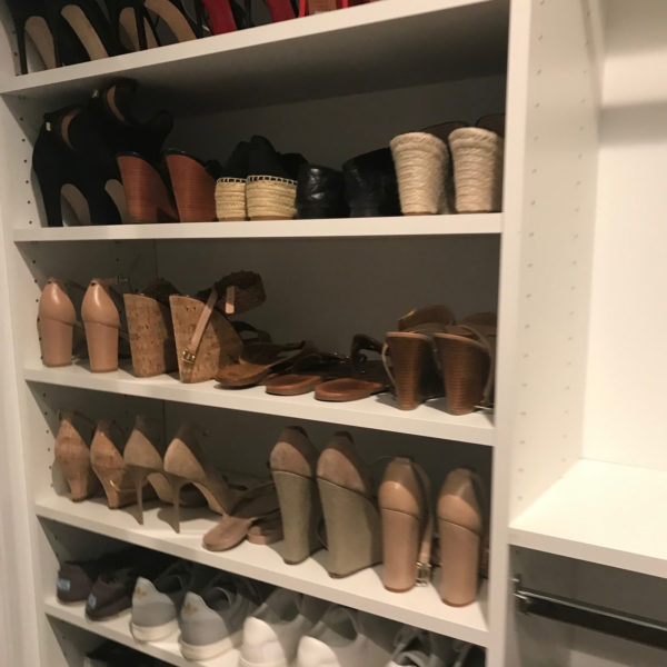 Shoes organized in clutter-free closet